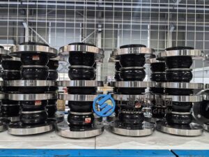 Double sphere rubber expansion joint for pipelines, showing flexible twin-bulb rubber bellows with metal flanges for vibration absorption and pipe movement compensation.